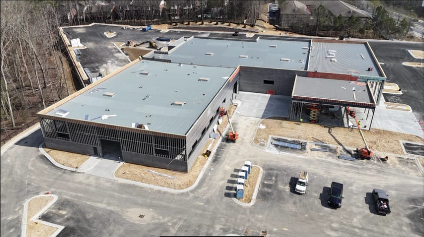 High-angle drone shot of the Mercedes-Benz of Buford dealership construction site and parking lot layout..png